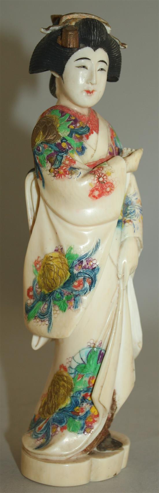 A Japanese coloured ivory figure of a bijin, early 20th century, 21cm